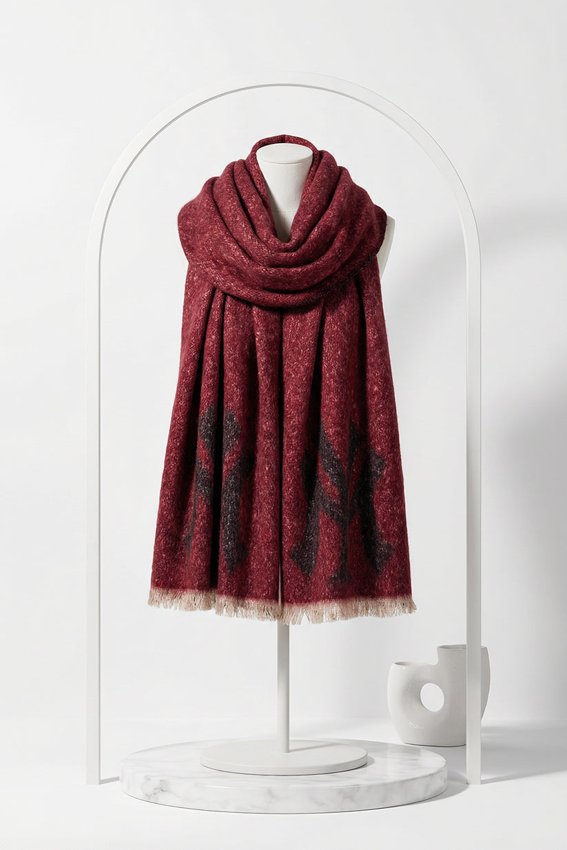 Red scarf on a mannequin against a white background