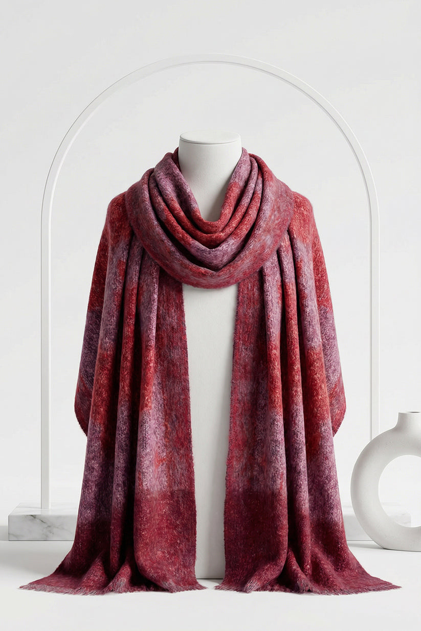 Red plaid scarf draped over a mannequin against a white background