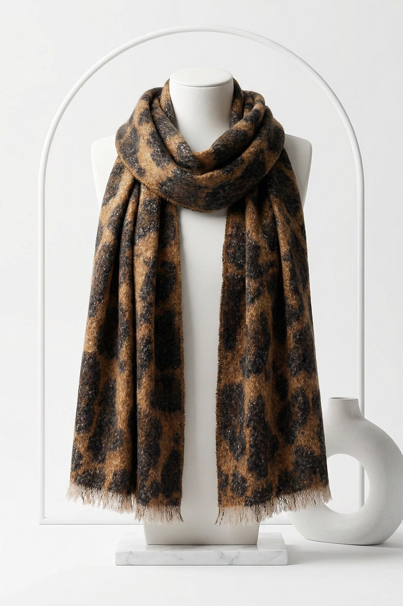 Leopard print scarf on a mannequin against a white background