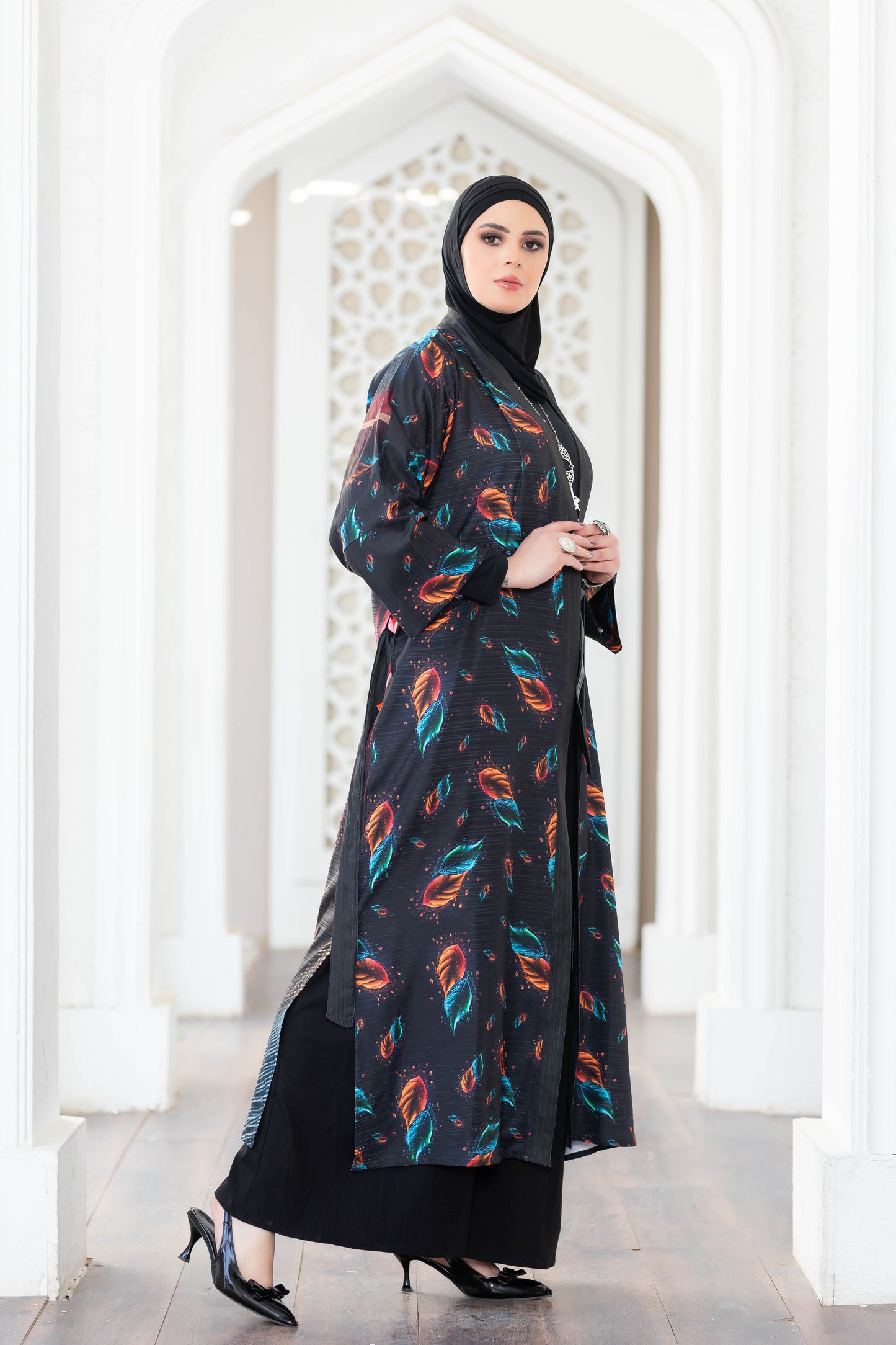Colorful feather print long kimono dress with hijab, stylish Muslim woman's fashion.