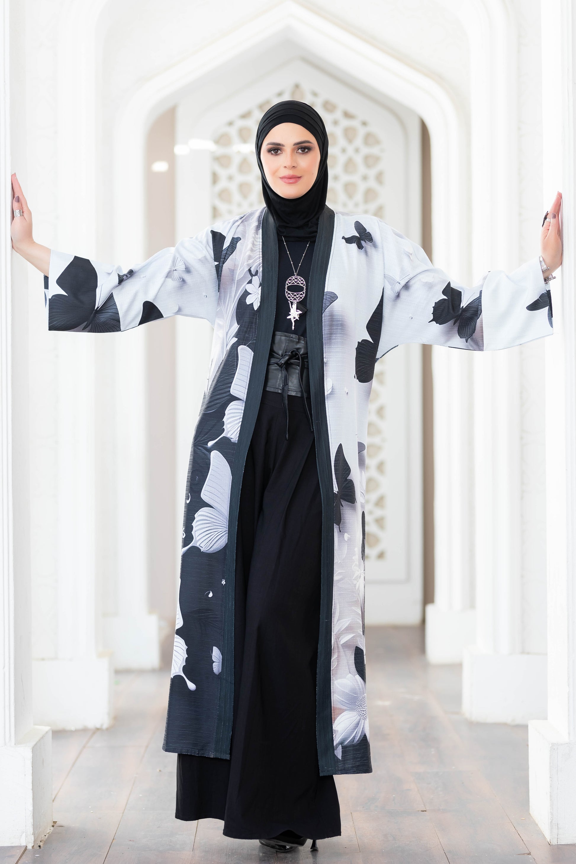 Beautiful black and white floral kimono with flowing sleeves in the image.