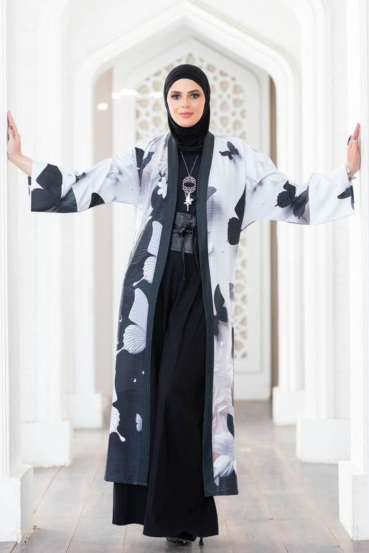Beautiful black and white floral kimono with flowing sleeves in the image.