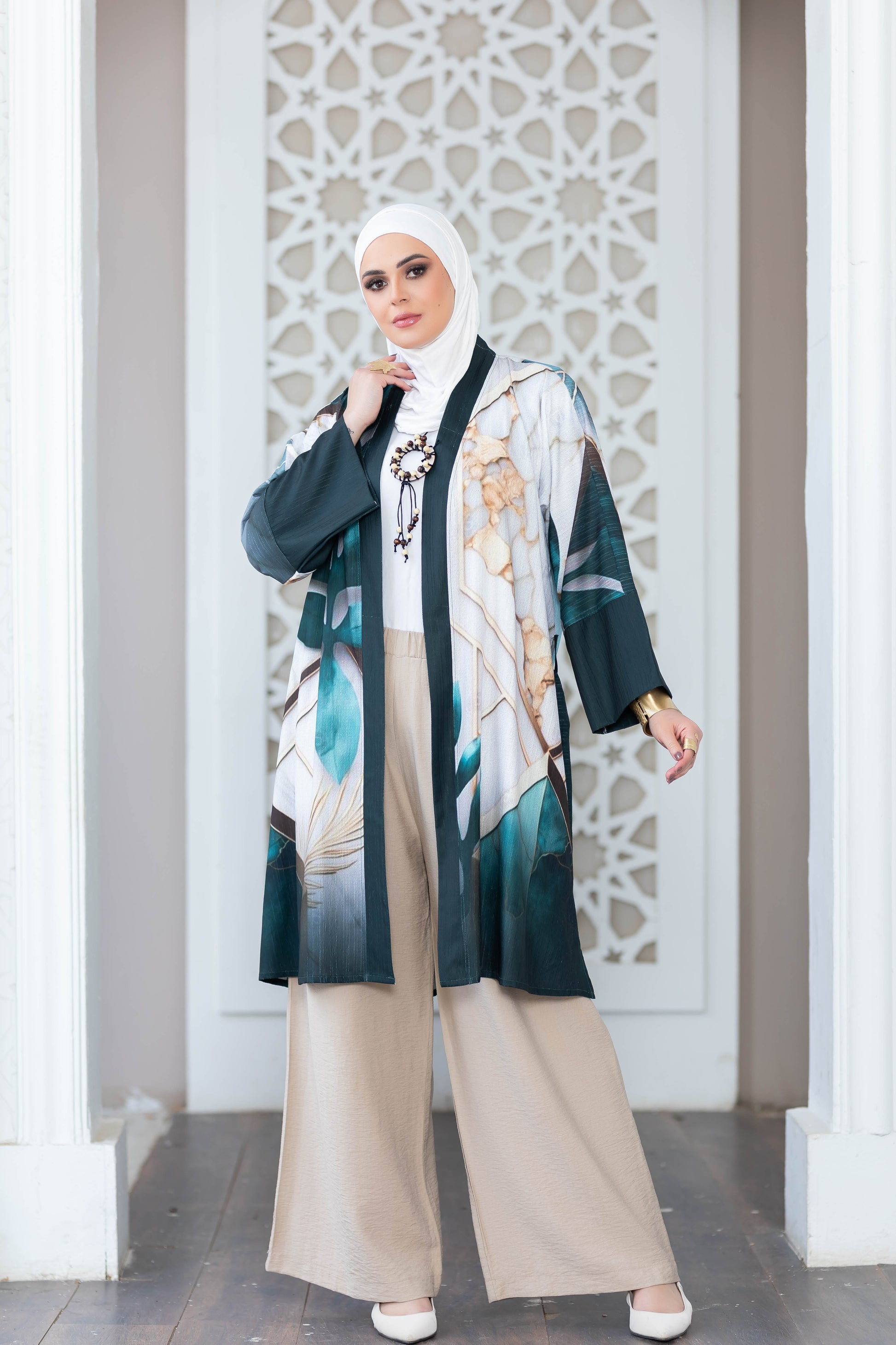 Elegant floral print short kimono with intricate white pattern backdrop.