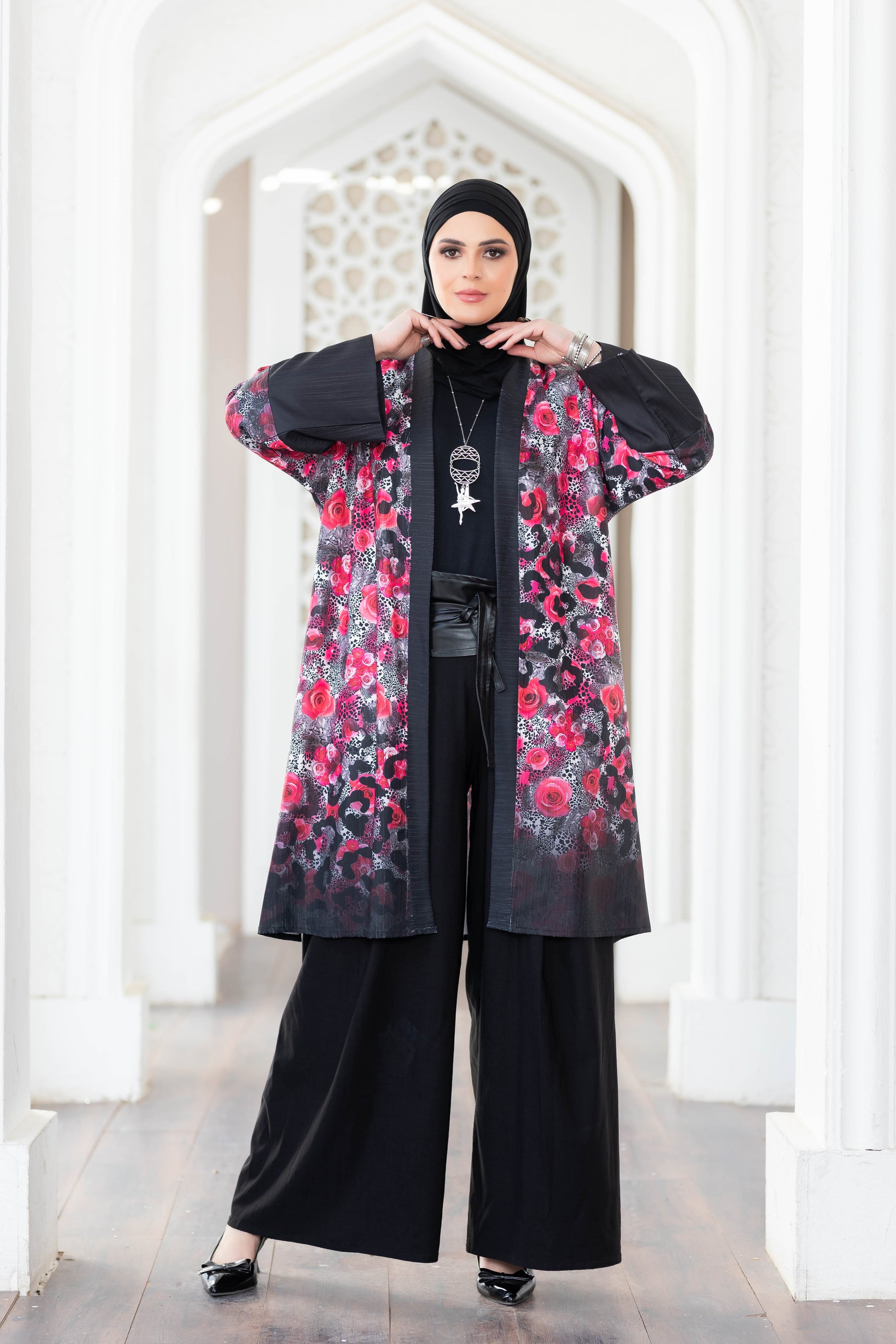 Vibrant floral-printed kimono with black accents on display