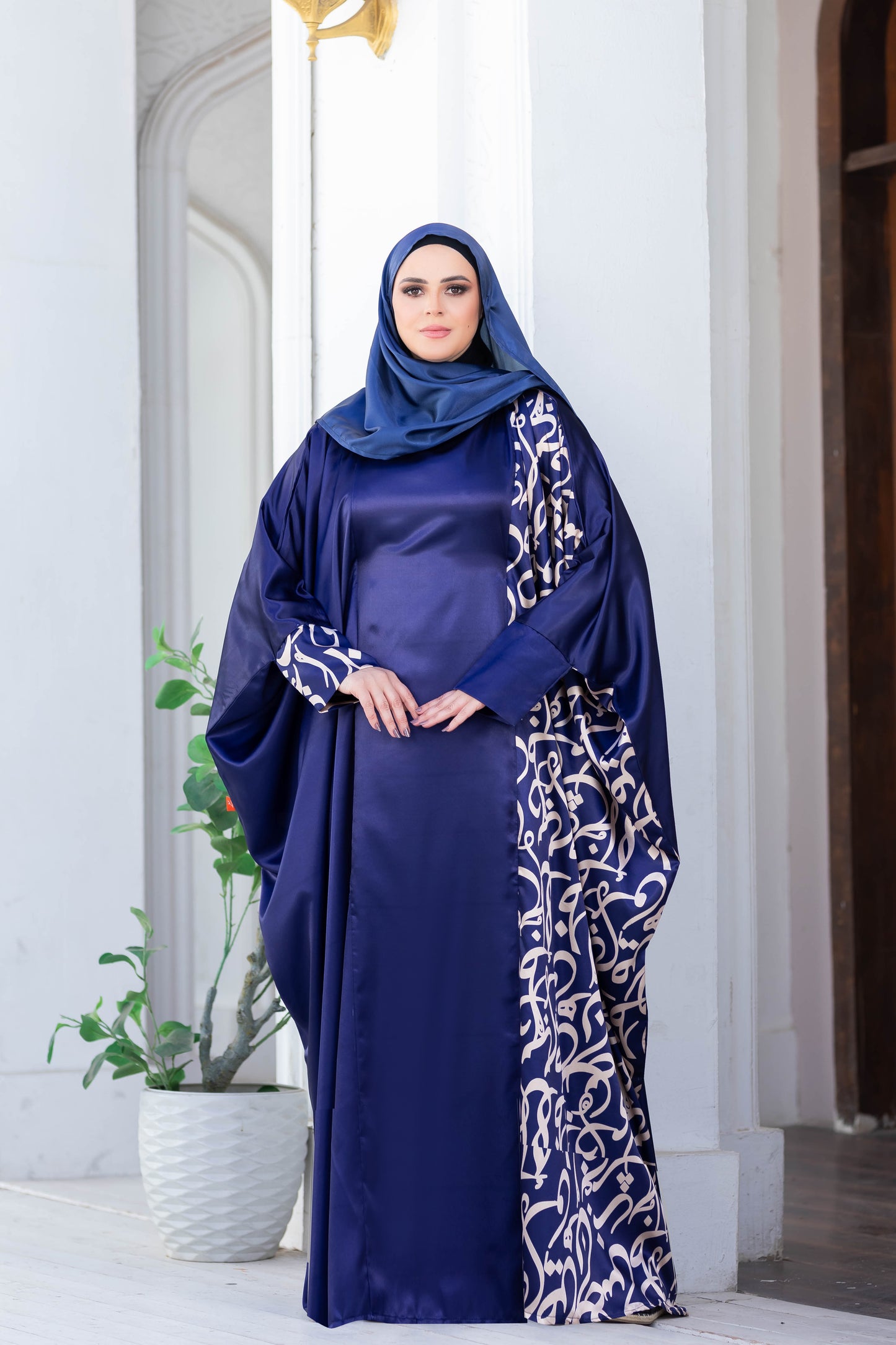 Modest satin Isdal 777189 dress in navy blue with intricate floral patterns