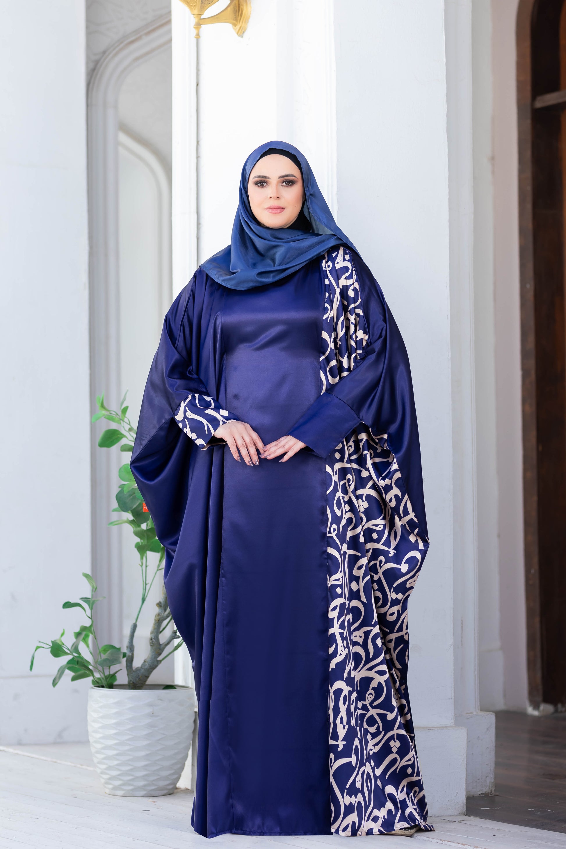 Modest satin Isdal 777189 dress in navy blue with intricate floral patterns