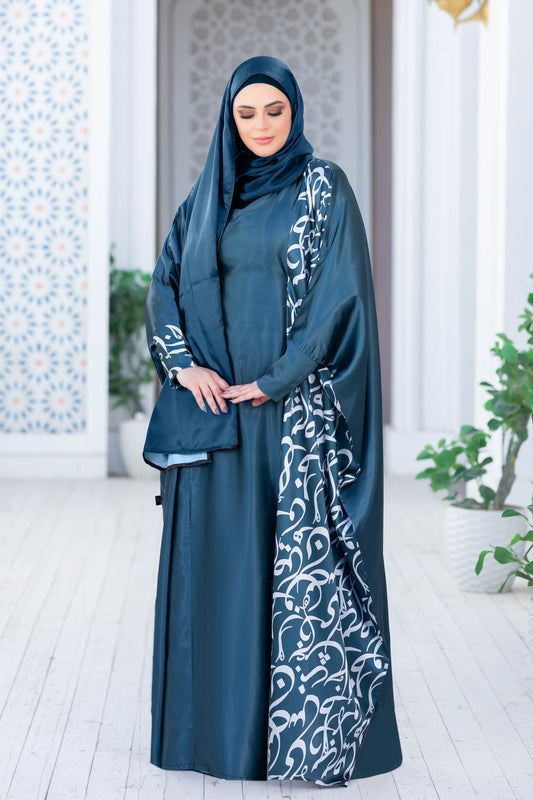 Modest satin dress with intricate embroidered patterns, worn by a woman in traditional Islamic attire.