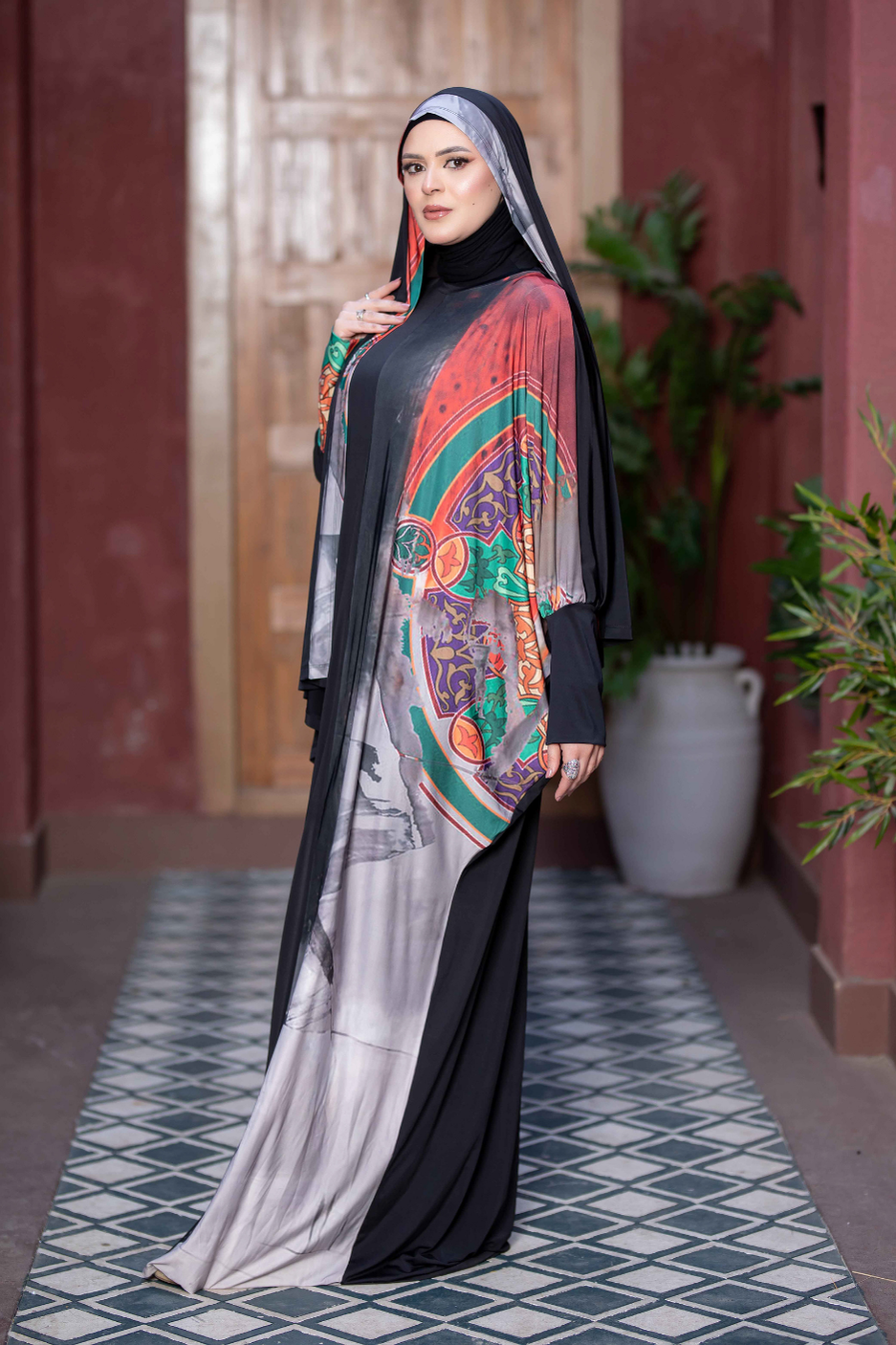 Elegant Islamic-inspired fashion: Vibrant patterned dress with sleeves, black hijab, and stylish modern design. Satr hejab 77762 ESDAL product from My Store.