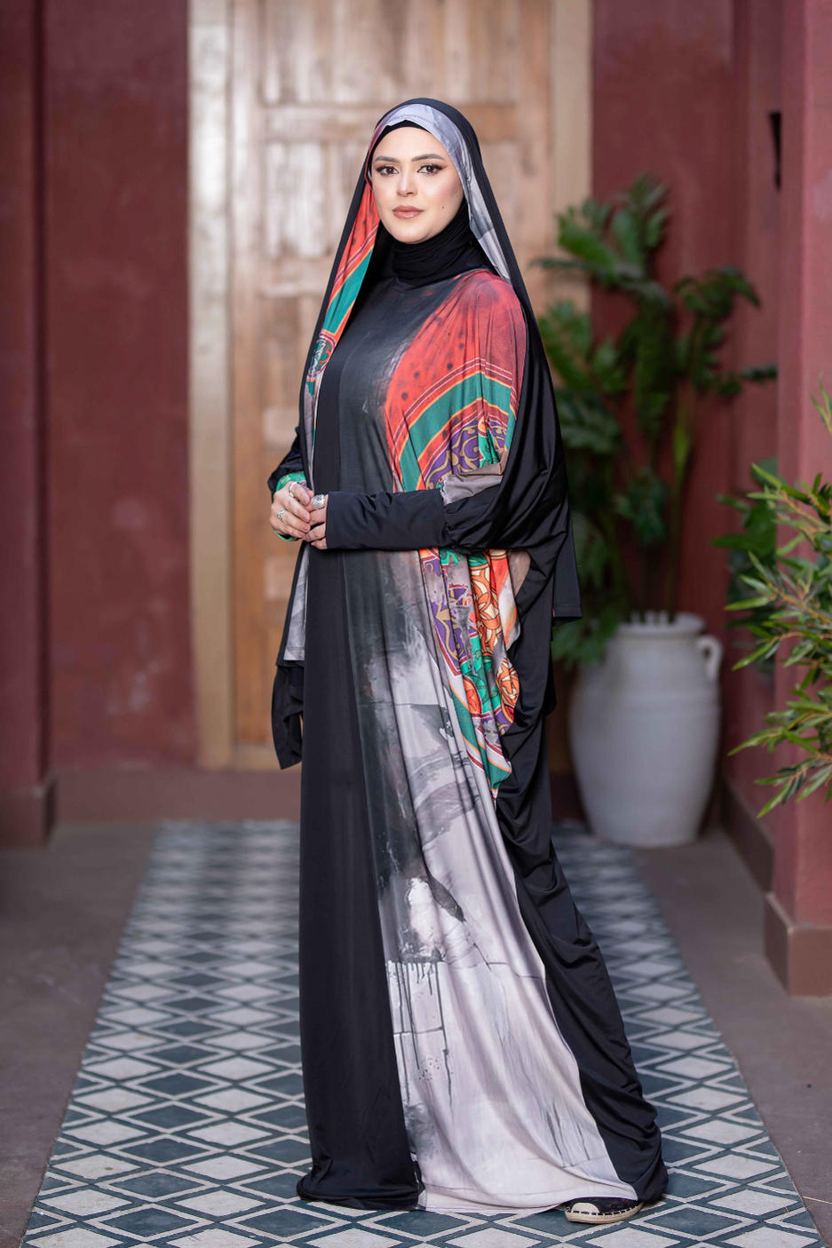 Vibrant Satr Hejab 77762 - Traditional modest attire with colorful embroidered patterns, worn by woman in front of rustic building.