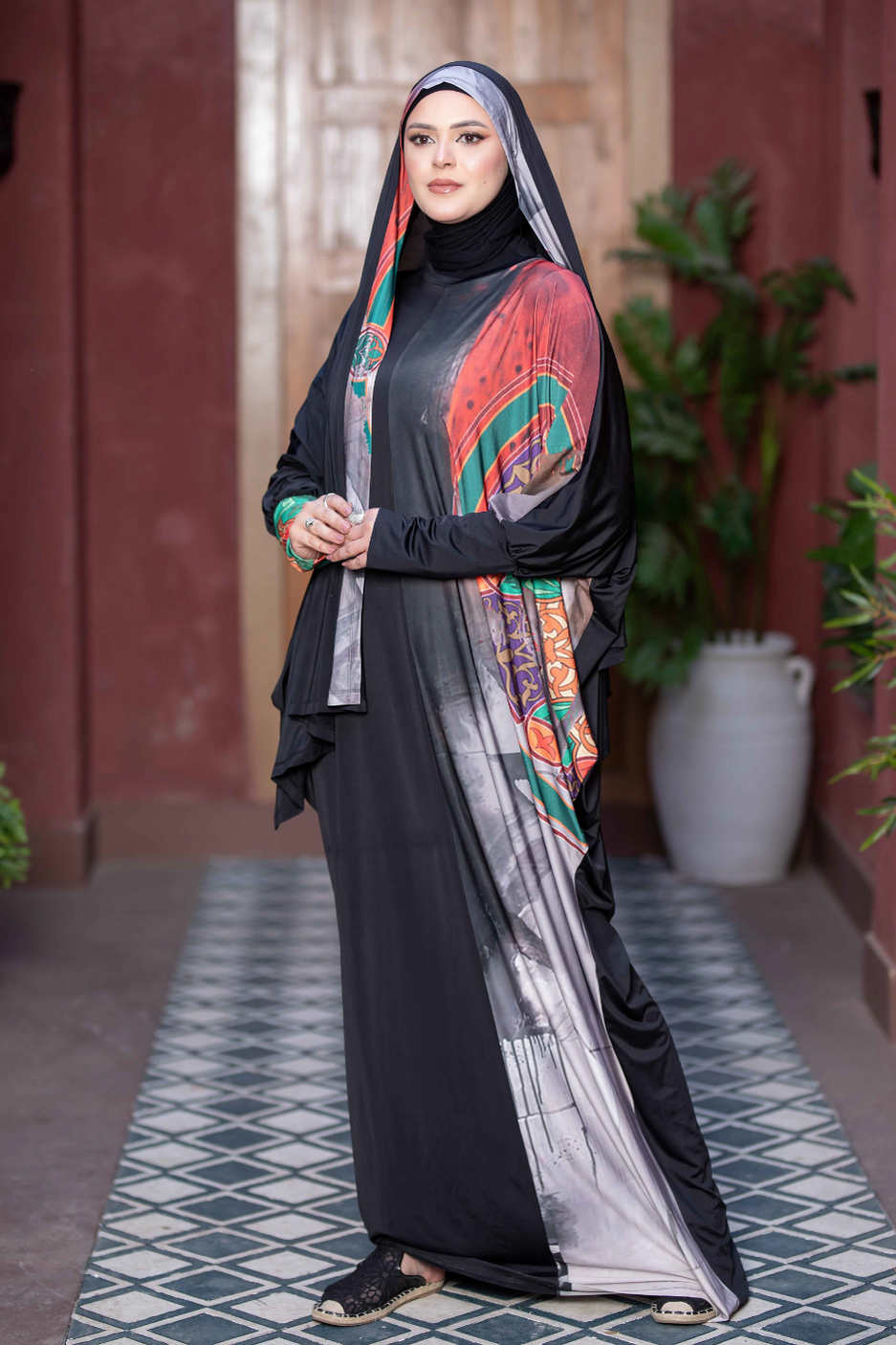 Stylish Satr Hejab 77762 - Elegant Middle Eastern fashion with vibrant colors and traditional patterns, captured in a graceful outdoor setting.