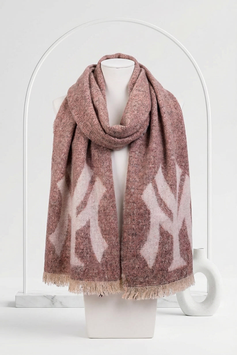 Pink patterned scarf on a mannequin against a white background