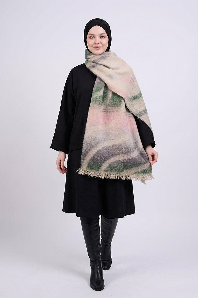 Woman wearing a black outfit with a patterned scarf on a white background