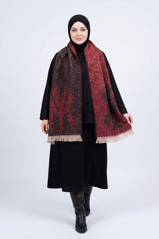 Woman wearing a black hijab, black outfit, and a patterned red and brown scarf on a white background