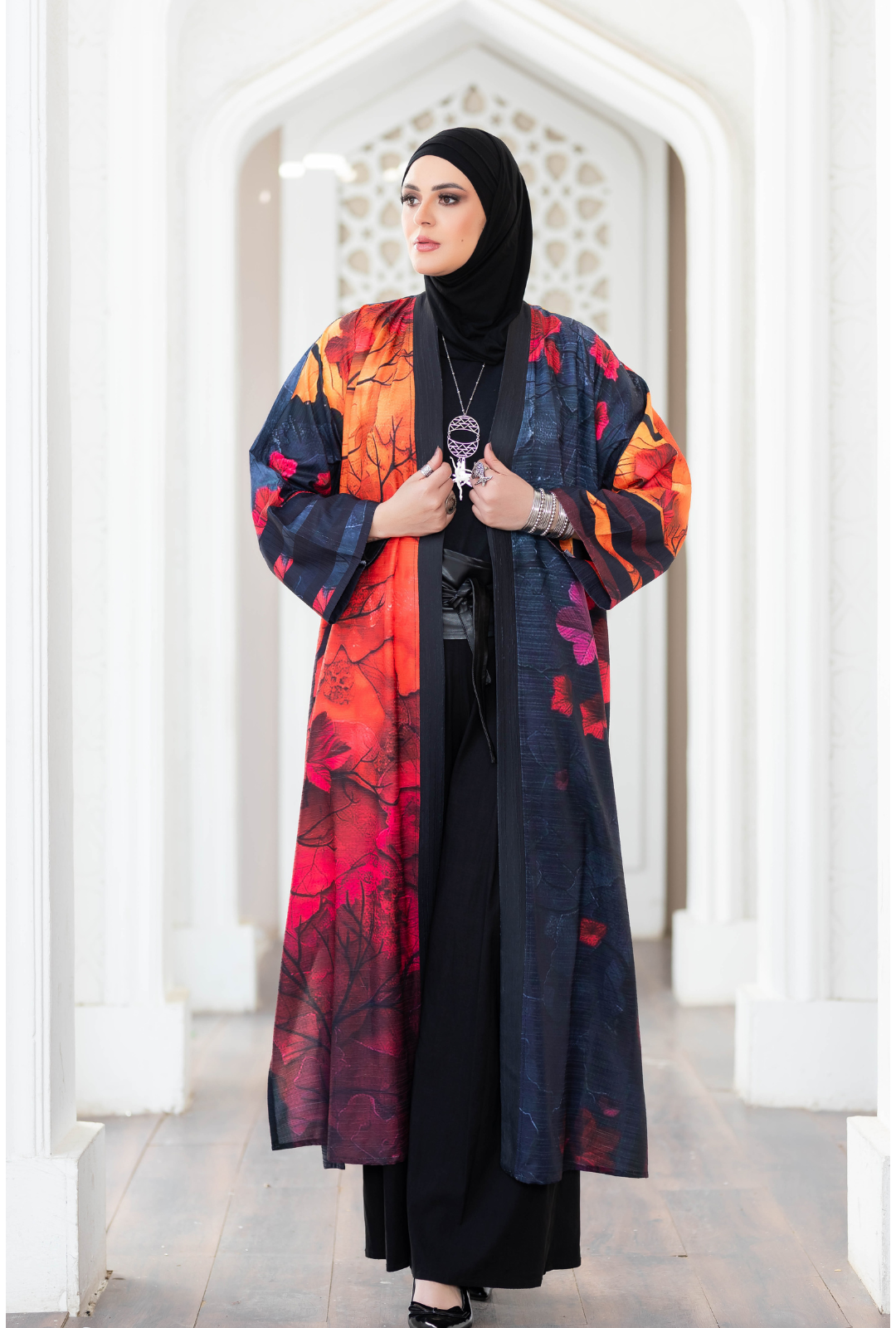 Vibrant floral-printed kimono showcased against architectural backdrop