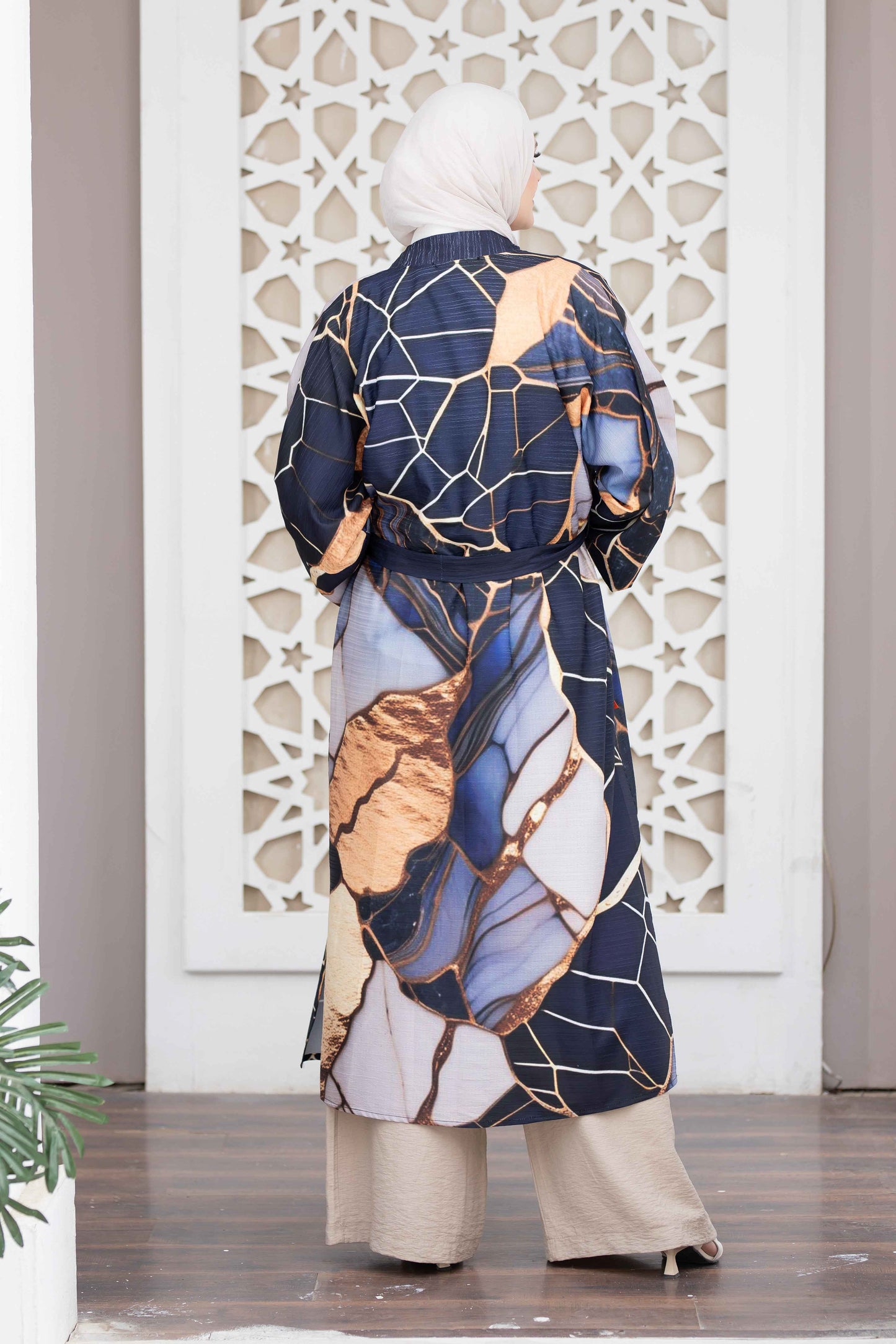 Elegant blue and gold patterned kimono on display