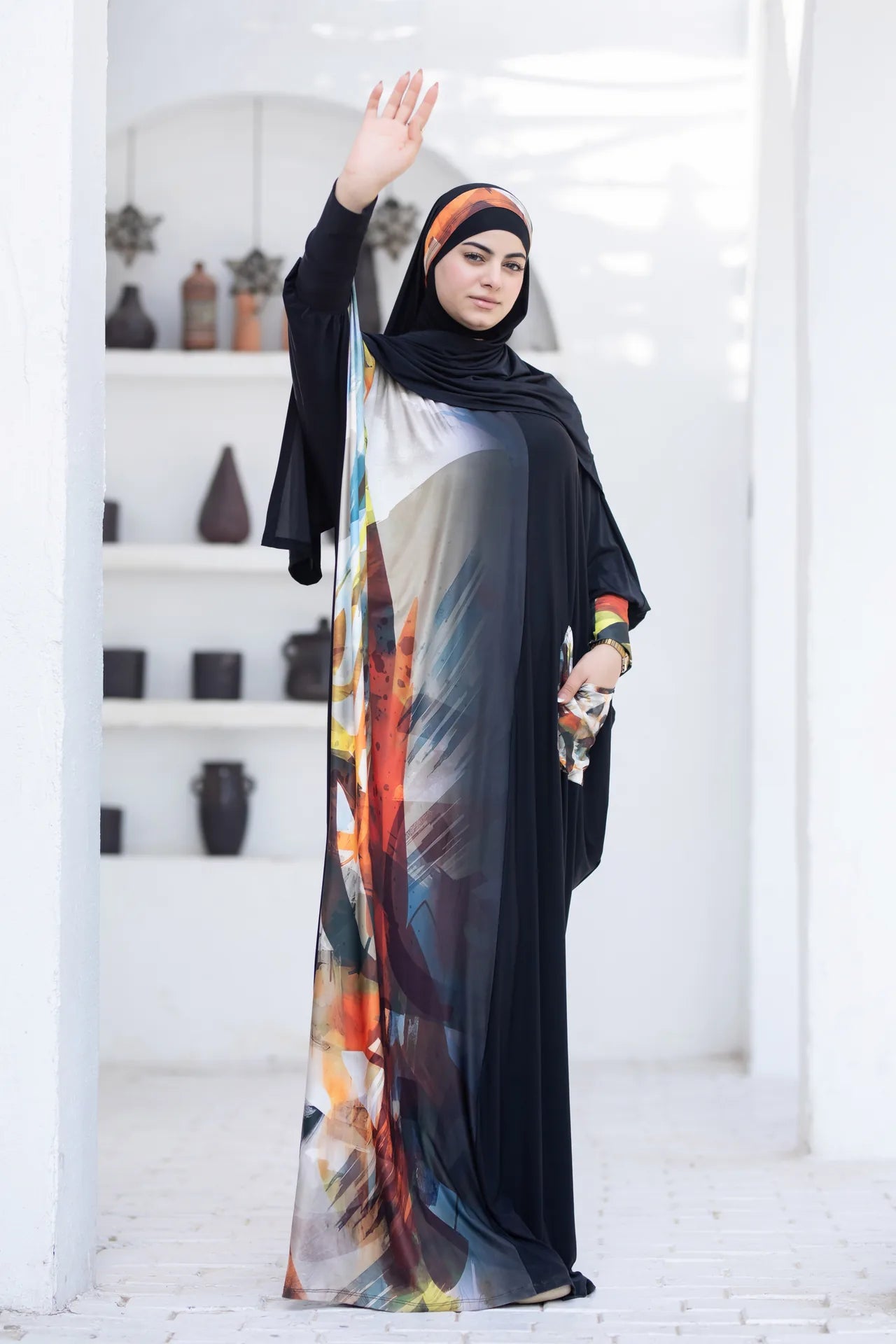 Side view of flowing isdal highlighting modern cut and confident style
