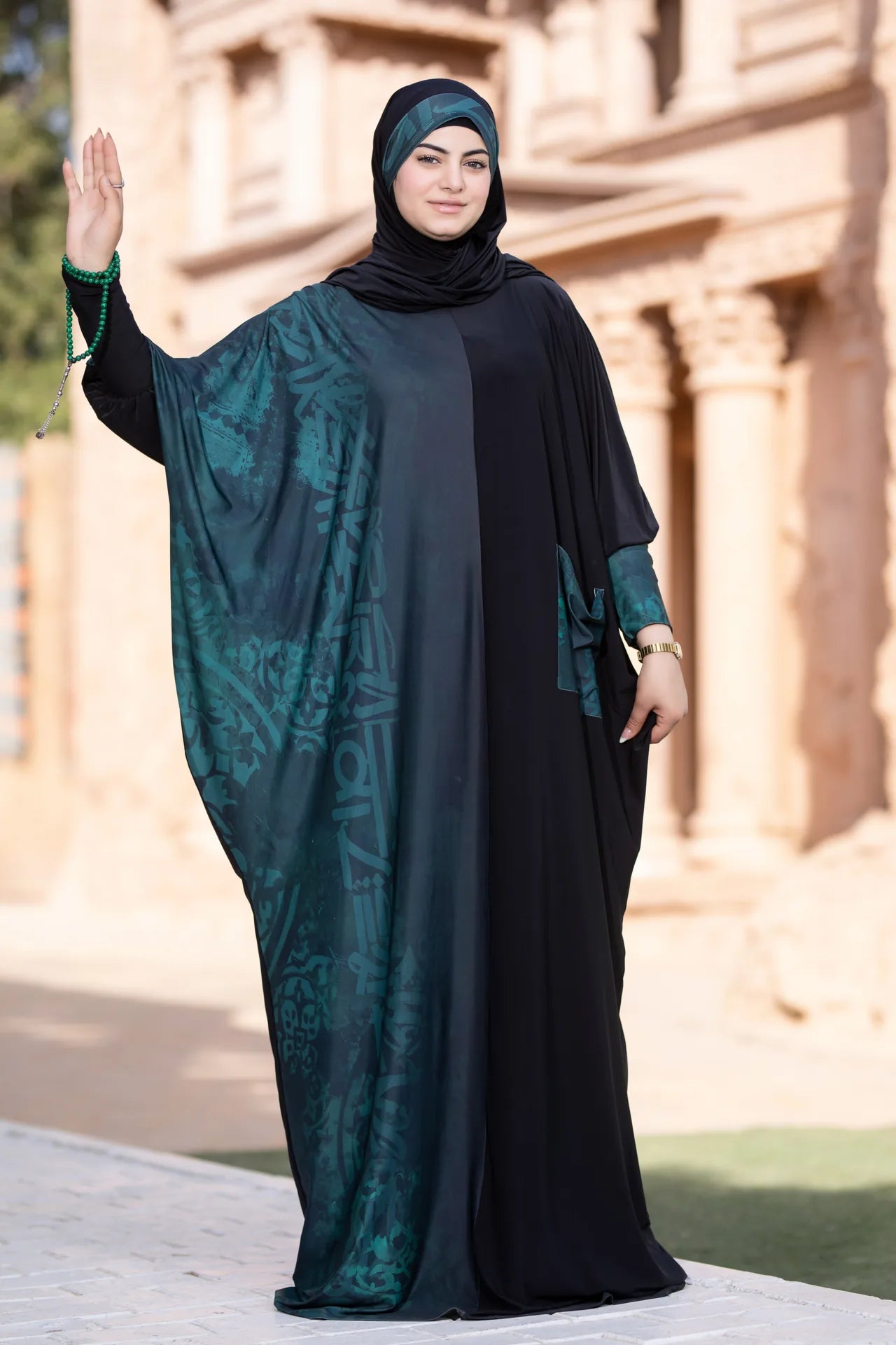 Model wearing confident isdal with strong and serene flowing design
