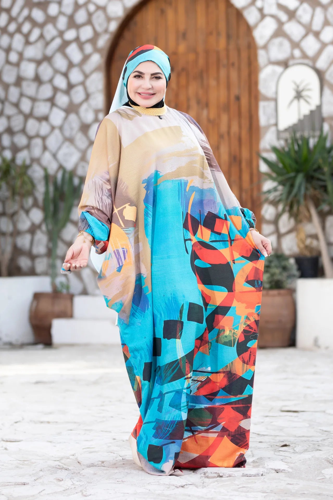 Side view of Mawj garment highlighting wide cut and fluid drape
