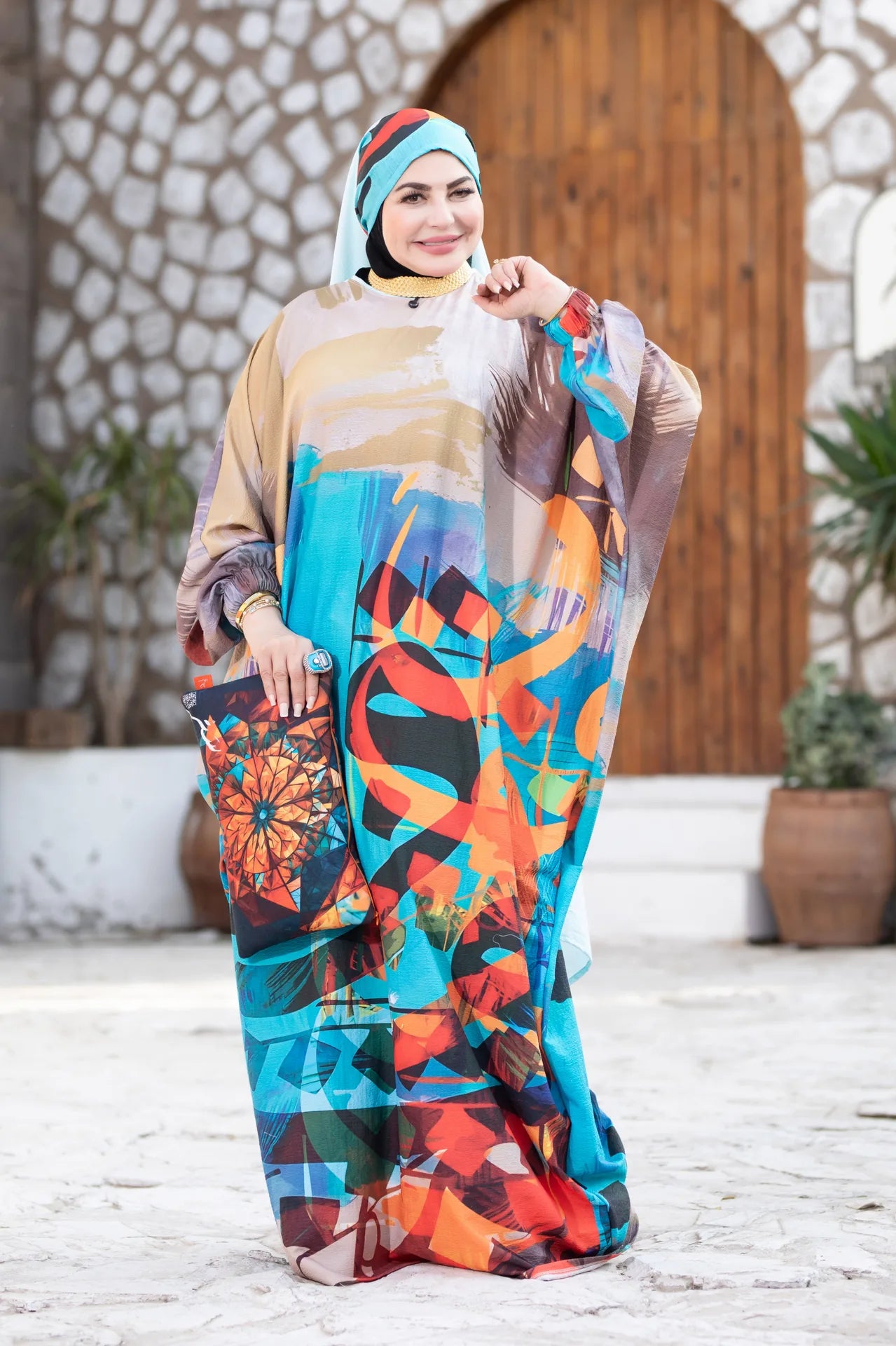 Back view of Mawj flowing garment with full coverage and artistic color layers
