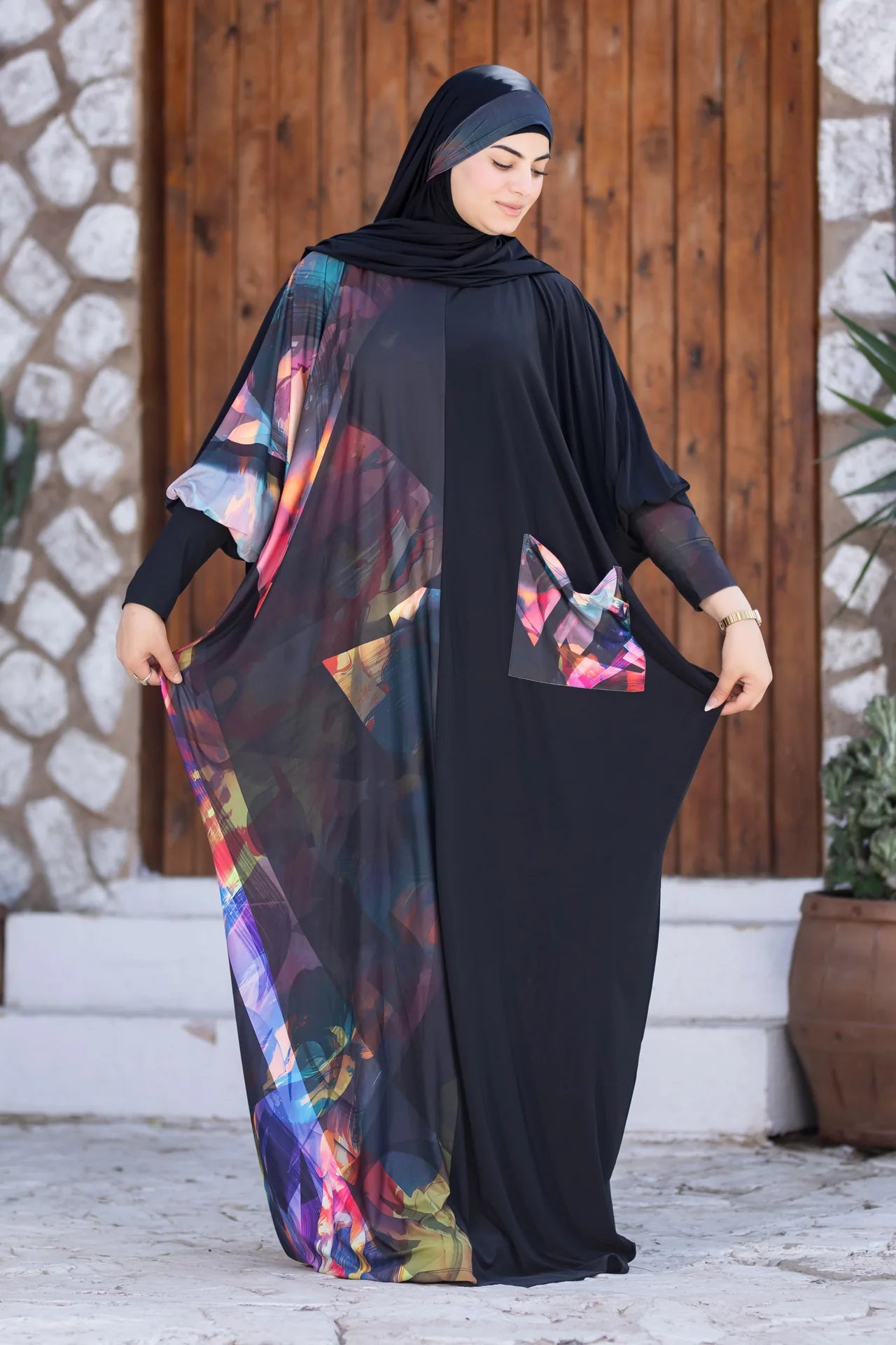 Model wearing graceful isdal with expressive colors and modern modest style
