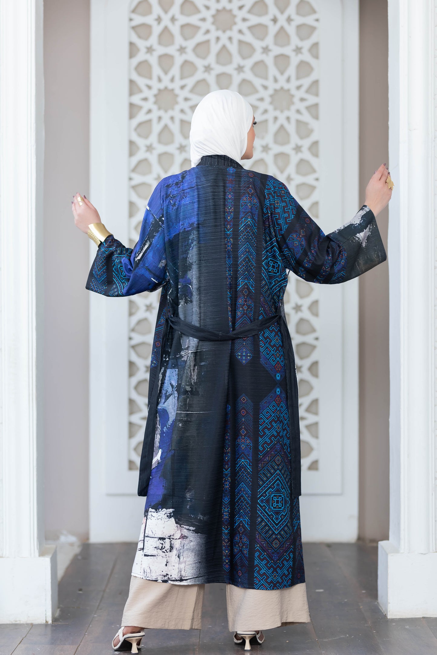 Colorful digital print kimono showcased against ornate architectural backdrop