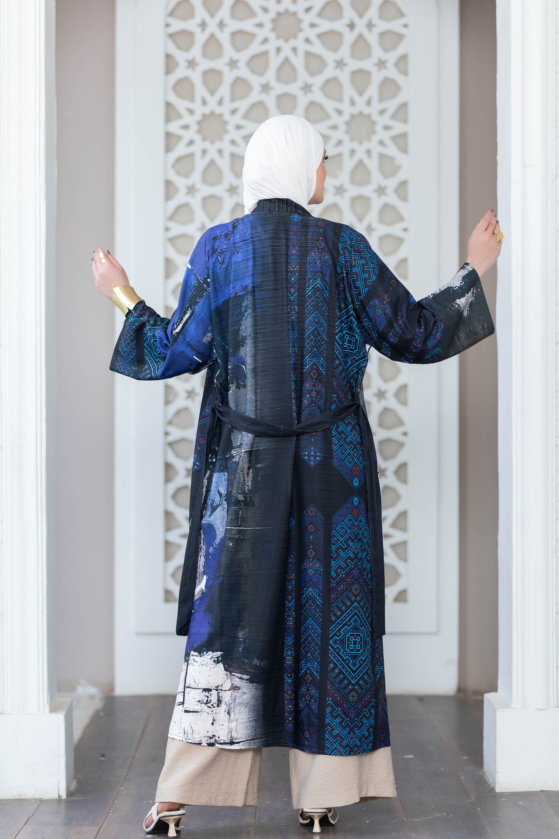 Colorful digital print kimono showcased against ornate architectural backdrop
