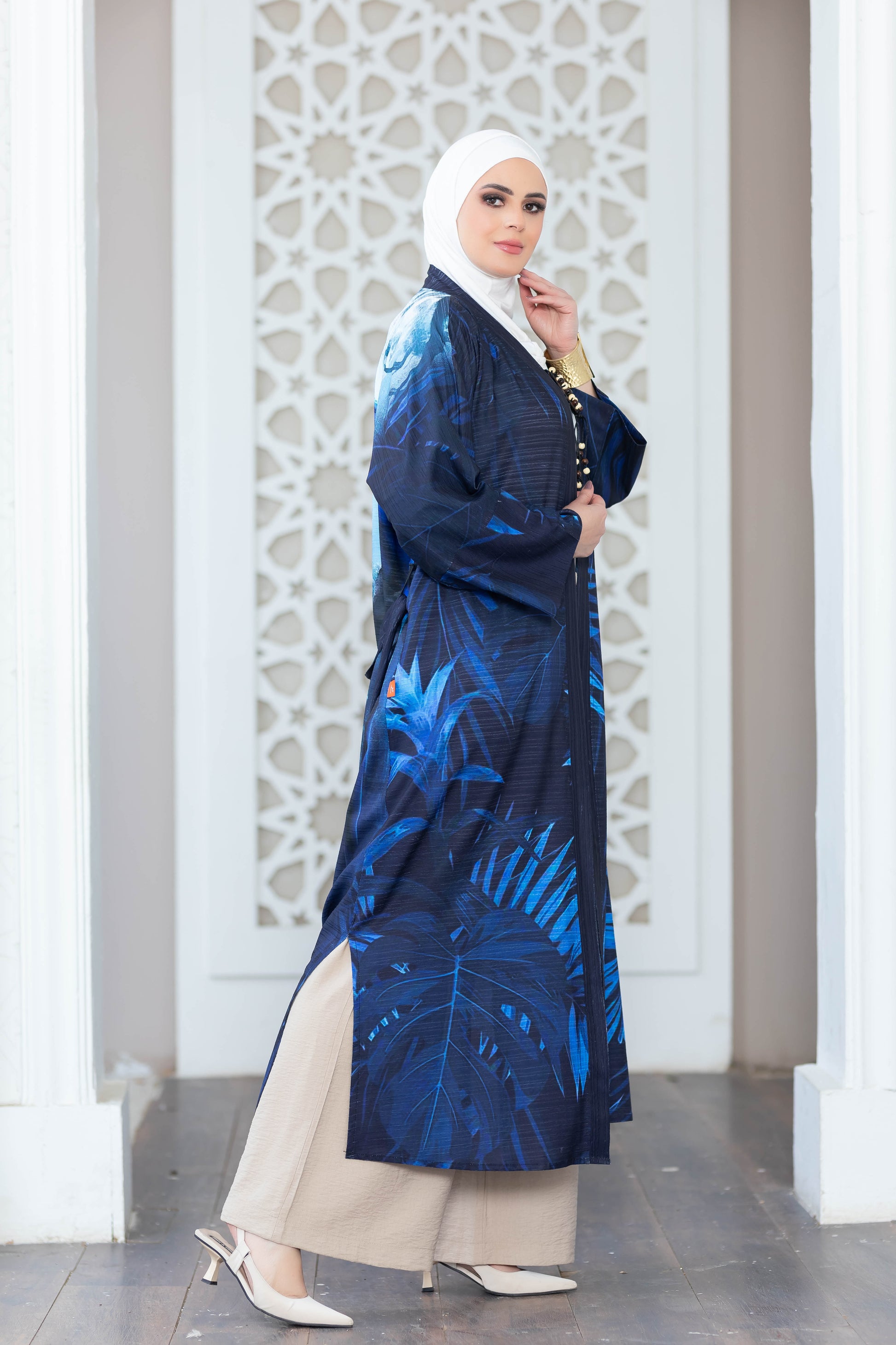 Digital print kimono in navy and blue hues against a decorative white backdrop.