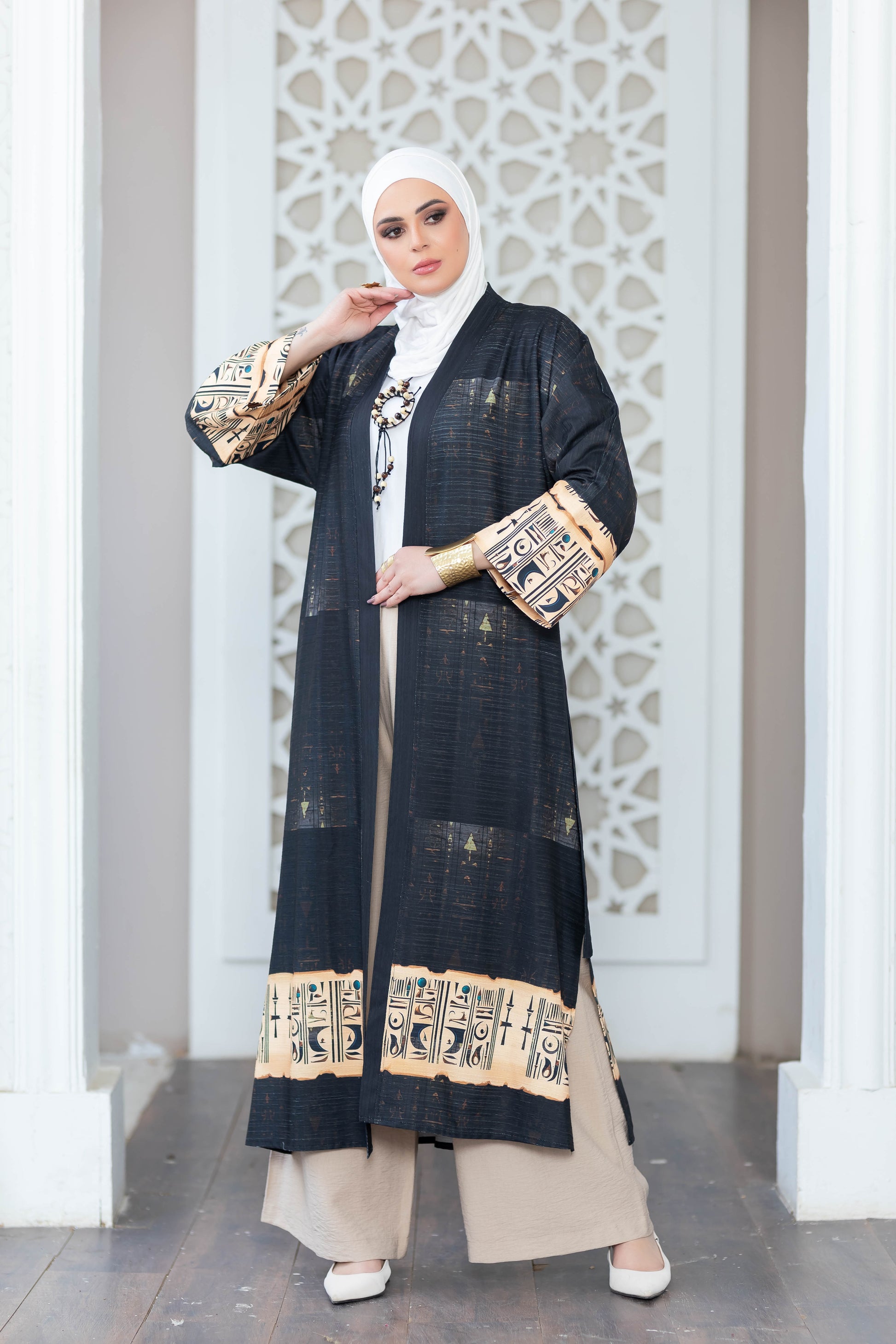Beautiful black floral print kimono with ornate pattern detail on satr clothing store display.