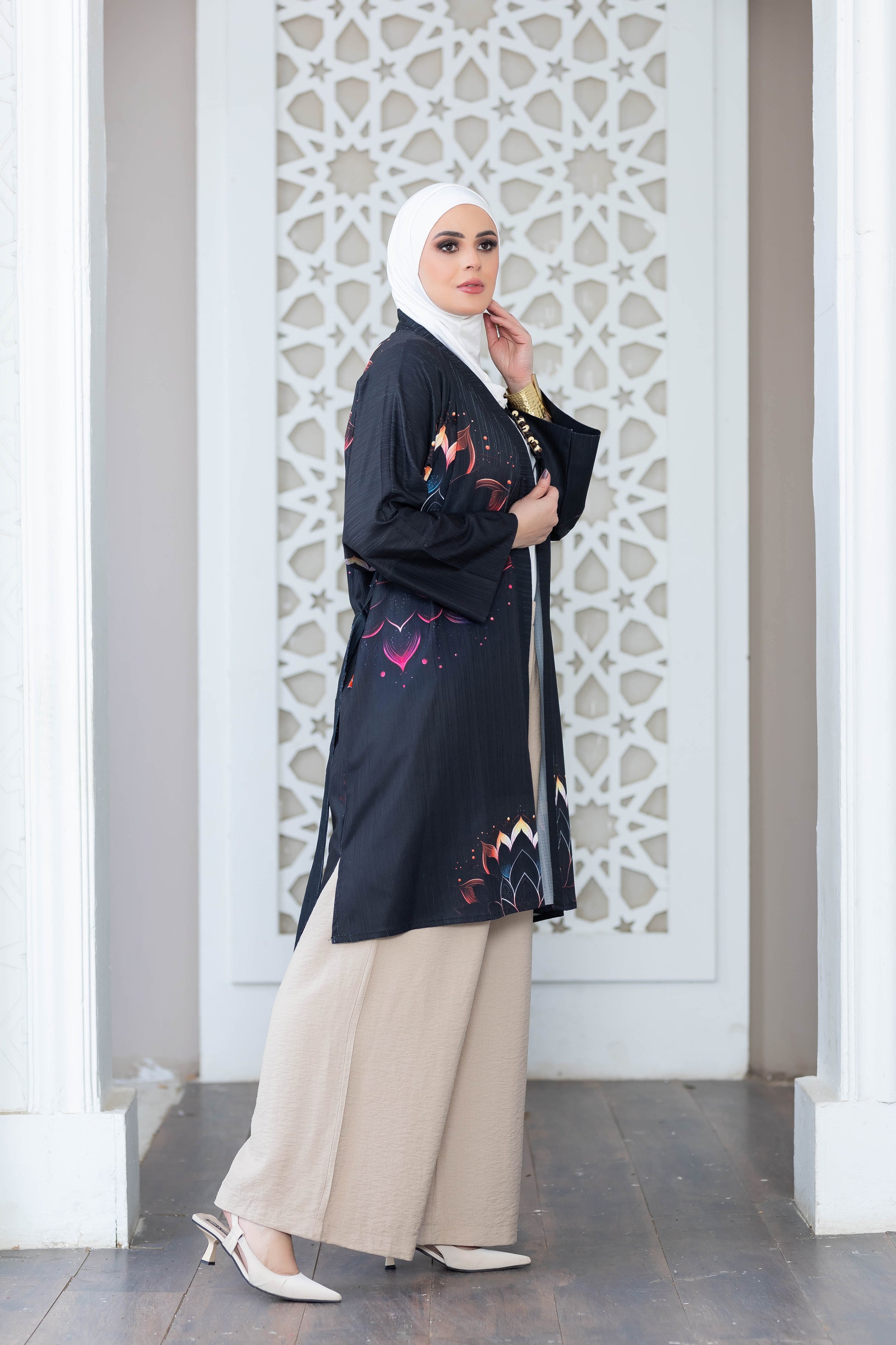 Elegant floral patterned kimono in front of decorative architecture