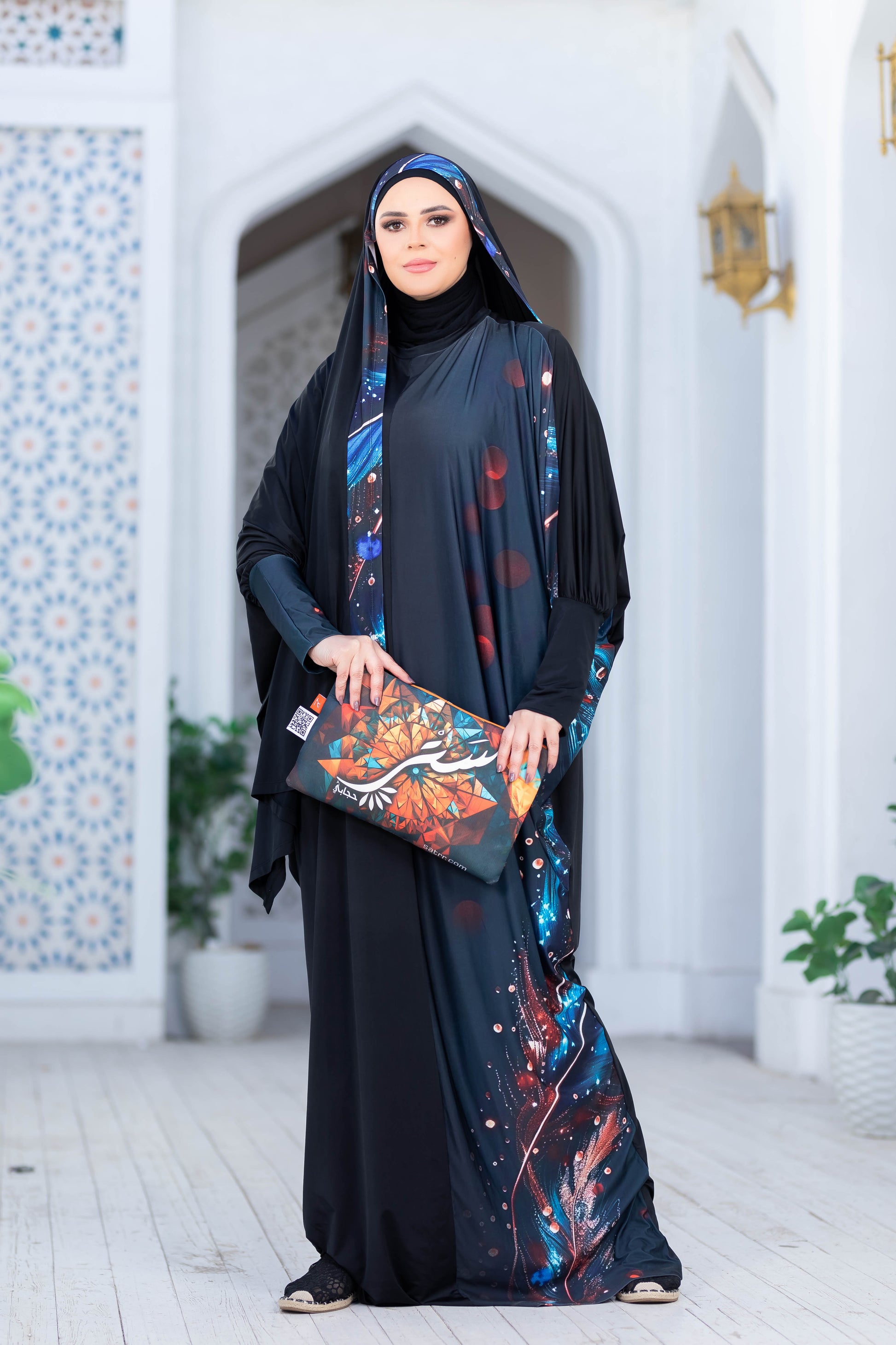 Elegant Arabic woman in traditional modest attire standing in ornate archway
