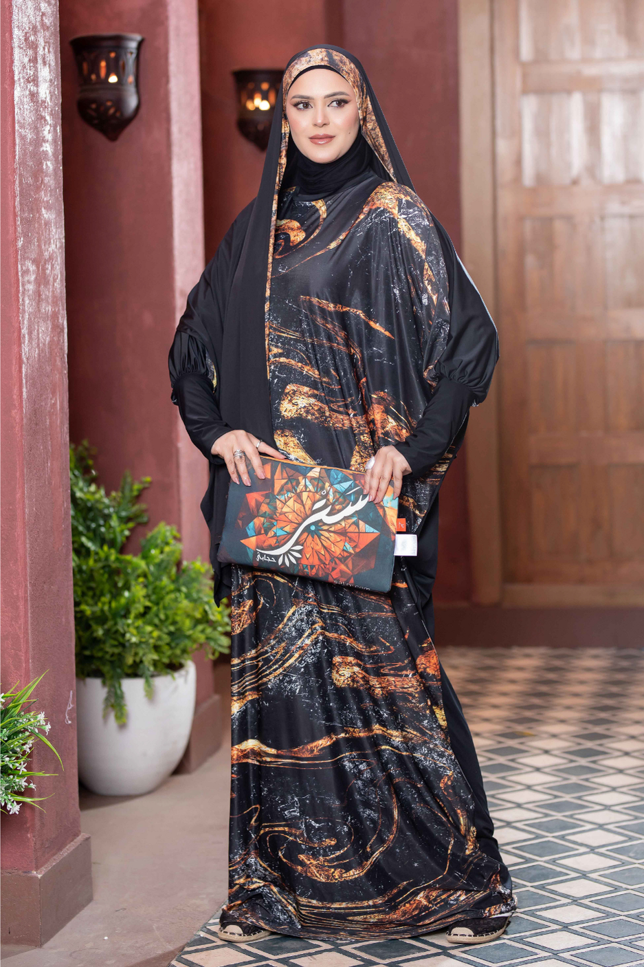 Elegant Islamic dress with intricate floral patterns, fashionable woman wearing traditional headscarf and robe, stylish traditional attire, cultural clothing.