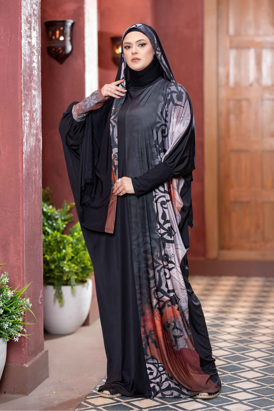 Elegant Satr Hejab 77764: Stylish Islamic fashion apparel with intricate floral patterns and flowing fabric, captured in a traditional setting.