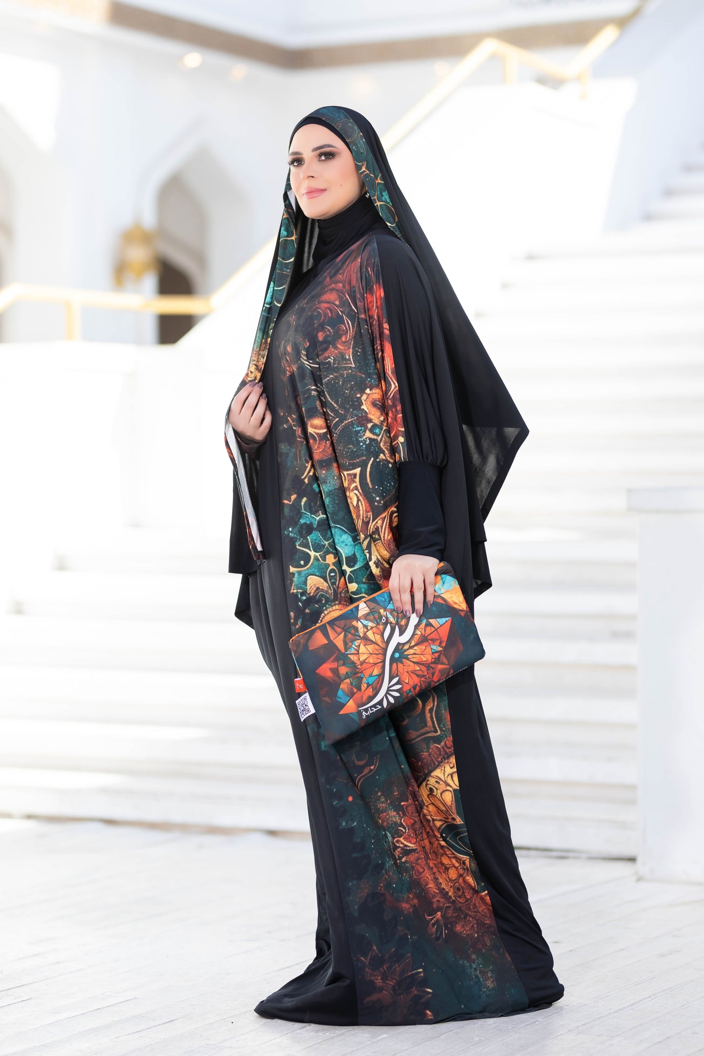 Elegant floral abaya with intricate patterns, modest and stylish Islamic attire for women.