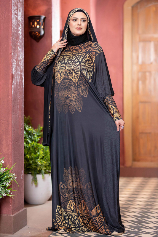 Elegant ethnic dress with intricate golden patterns on a dark background, featuring a woman wearing a traditional headscarf.